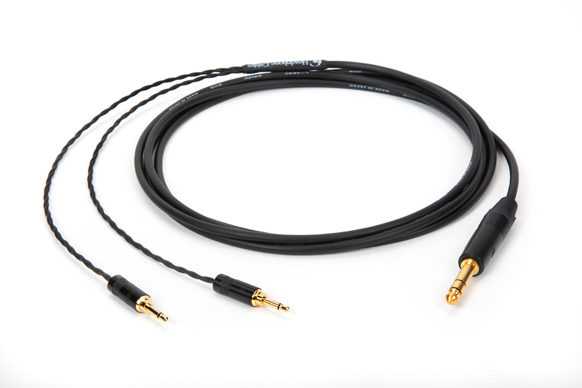 Close-up of 10ft Canare L-4E5C universal headphone cable with dual 3.5mm mono and 1/4" TRS plug